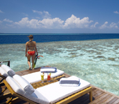 SunseetWaterSuite_Exterior_Deck_WithGirl